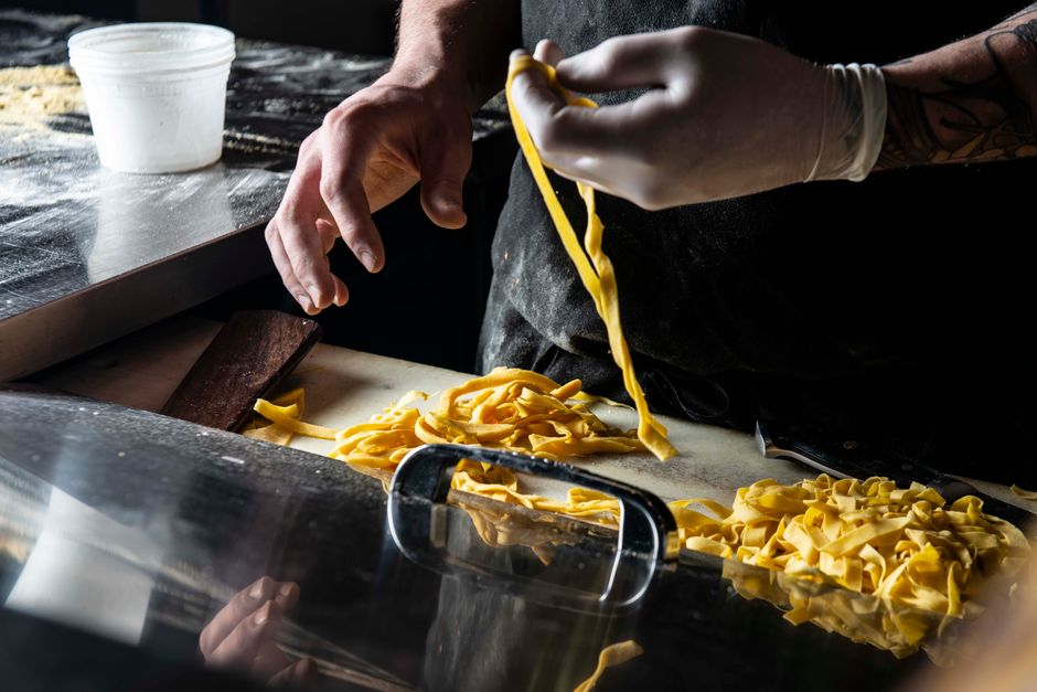Elegant professional kitchen with expert pasta cooking preparation and quality culinary operations