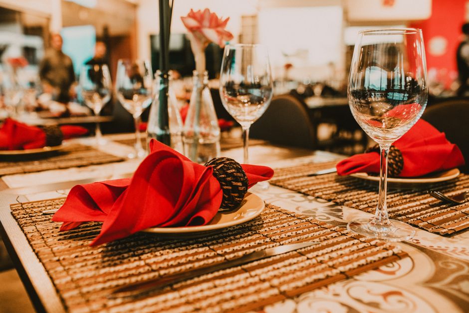 Gourmet fine dining experience with elegant table setting and upscale restaurant ambiance