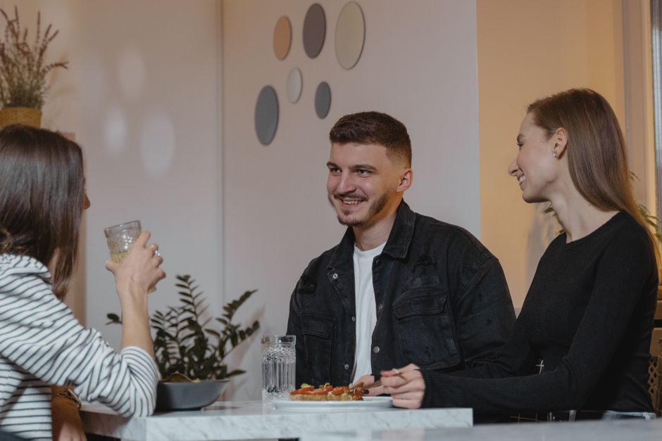 Premium upscale restaurant group dining with happy diners enjoying fine Italian cuisine